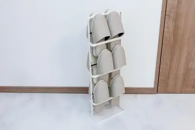 a stack of shoes on a wall next to a mirror at The Felice Uguisudani - Vacation STAY 96221 in Tokyo
