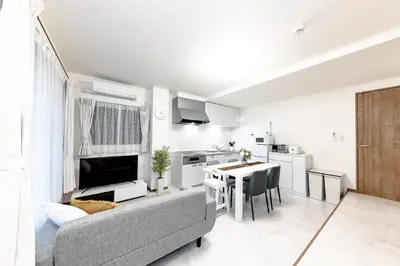 a living room with a couch and a table at The Felice Uguisudani - Vacation STAY 96221 in Tokyo
