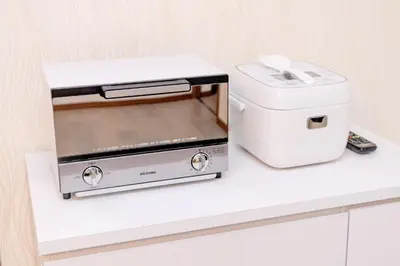 a toaster and a toaster oven sitting on a counter at The Felice Uguisudani - Vacation STAY 96241 in Tokyo