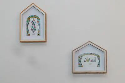 two framed pictures hanging on a white wall at The Felice Uguisudani - Vacation STAY 96241 in Tokyo