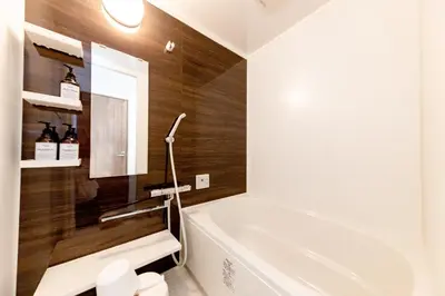 a bathroom with a white tub and a sink at The Felice Uguisudani - Vacation STAY 96241 in Tokyo