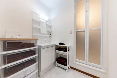 a bathroom with a sink and a shower at The Felice Uguisudani - Vacation STAY 96242 in Tokyo