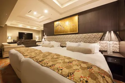 a hotel room with a large bed and a television at Centurion Hotel Grand Akasakamitsuke Station in Tokyo