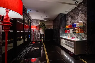 a restaurant hallway with a drink cooler and a lamp at HOTEL VARKIN Ikebukuro Nishiguchi in Tokyo
