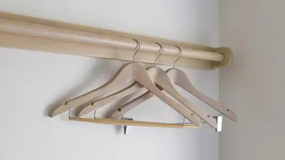 a rack of wooden hangers in a room at Toyoko Inn Tokyo eki Shin ohashi Mae in Tokyo