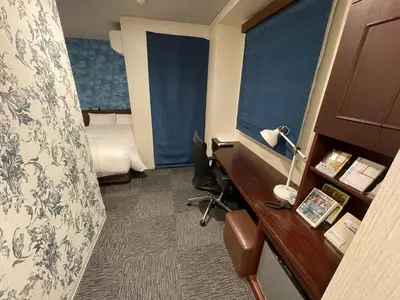 a hotel room with a desk and a bed at No, 2 Taniji Building - Vacation STAY 91347v in Tokyo