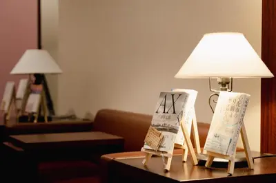 a table with a lamp and signs on it at No, 2 Taniji Building - Vacation STAY 92282v in Tokyo