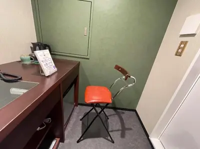 a desk with a red chair in front of a mirror at No, 2 Taniji Building - Vacation STAY 91383v in Tokyo