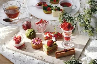 a table topped with cakes and strawberries and drinks at Tokyo Marriott Hotel in Tokyo