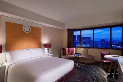 a hotel room with a large bed and a window at Tokyo Marriott Hotel in Tokyo