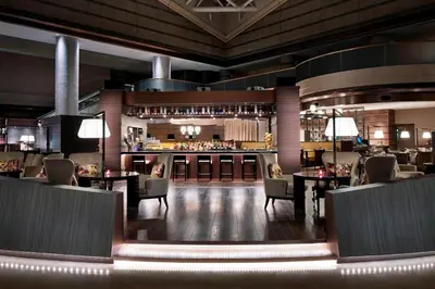 a restaurant with tables and chairs and a bar at Tokyo Marriott Hotel in Tokyo
