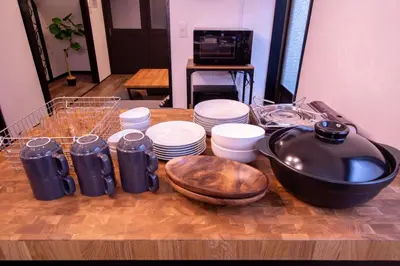 a table with a bunch of dishes and a bowl at FuwaFuwa - Vacation STAY 12411 in Tokyo