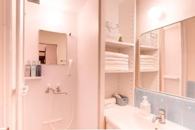 a bathroom with a sink and a mirror at FuwaFuwa - Vacation STAY 12411 in Tokyo