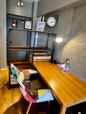 a room with a wooden desk with a clock on the wall at Shinjuku 1003-SJ0303 in Tokyo
