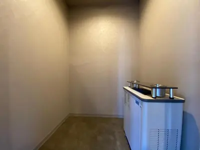 a corner of a room with a small refrigerator at LANG HOTEL Kameido-2#Near Akihabara#\u30c1\u30a7\u30c3\u30af\u30a2\u30a6\u30c8\u306e\u307f\u6e05\u6383\u3042\u308a in Tokyo
