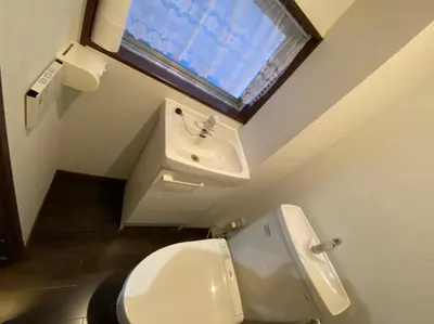 a bathroom with a white toilet and a sink at Takemura Building 2nd floor in Tokyo