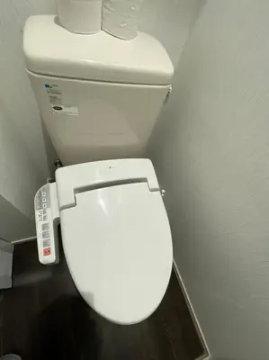 a bathroom with a white toilet in a room at Takemura Building 2nd floor in Tokyo