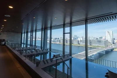 a building with a view of a river and a bridge at La Vista Tokyo Bay in Tokyo
