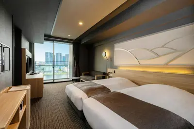 a hotel room with two beds and a large window at La Vista Tokyo Bay in Tokyo
