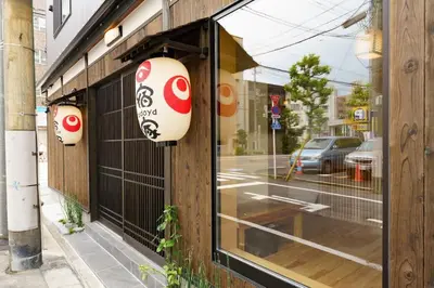a window of a store with a sign on it at YADOYA Fukurou in Tokyo