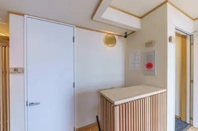 a room with a heater in the corner of a room at YADOYA Fukurou in Tokyo