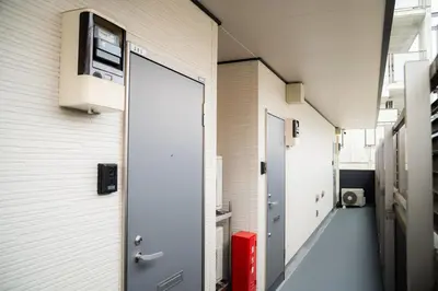 a corridor of a building with a hallway at E JOY INN-Okubo branch in Tokyo