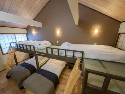 a room with two bunk beds in a house at YADOYA Matsugaya in Tokyo