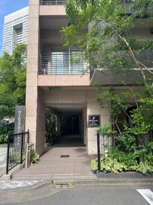 a building with a walkway in front of it at Kuretake Inn Premium Hamamatsucho in Tokyo