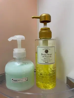 a bottle of soap and a soap dispenser on a shelf at HotelHarmony\u65e5\u66ae\u91cc\u30db\u30c6\u30eb\u30cf\u30fc\u30e2\u30cb\u30fc in Tokyo