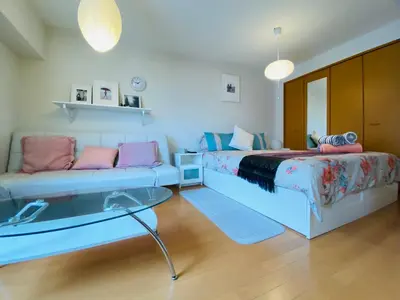 a living room with two beds and a couch at Suny402-SJ0007 in Tokyo