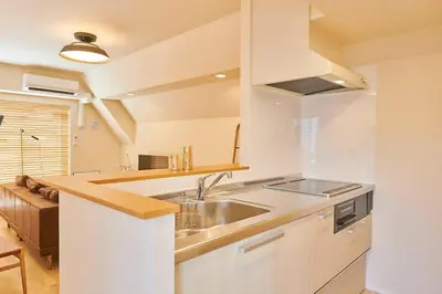 a kitchen with a sink and a counter top at \u6c5f\u6238\u5ddd\u6a4b\u30ec\u30b8\u30c7\u30f3\u30b9 EDOGAWABASHI RESIDENCE in Tokyo