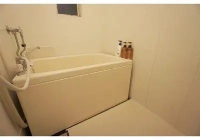 a white bath tub in a bathroom with a toilet at Woody Sanheim - Vacation STAY 12558 in Tokyo