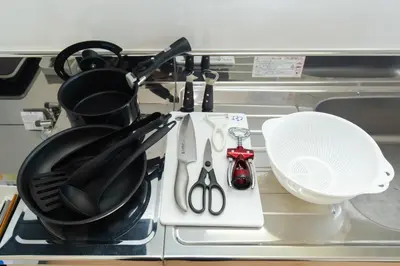 a kitchen counter with utensils on a stove at \u5510\u6ca2\u30db\u30c6\u30eb Karasawa-Hotel in Tokyo