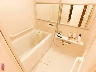 a bathroom with a tub and a sink and a mirror at WY-Kabukicho 604-SJ0163 in Tokyo
