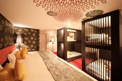 a bedroom with a large bed in a room at Centurion Hotel Ueno in Tokyo