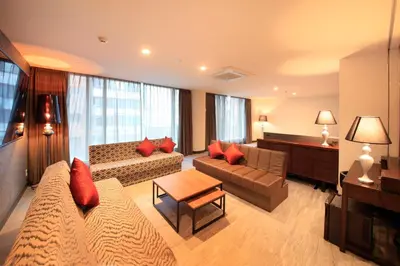 a living room with a couch and a table at Centurion Hotel Ueno in Tokyo
