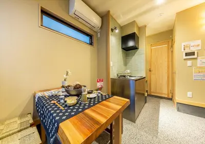 a kitchen with a table with a bowl of food on it at YADOYA Iroha in Tokyo