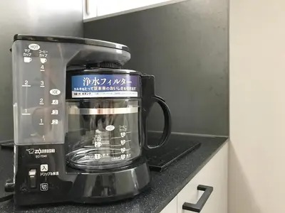 a coffee maker sitting on a kitchen counter at PRISM INN OGU in Tokyo
