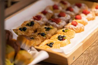 a tray of pastries with fruit on top at Courtyard by Marriott Tokyo Station in Tokyo