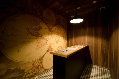 a room with a large world map on the wall at Courtyard by Marriott Tokyo Station in Tokyo