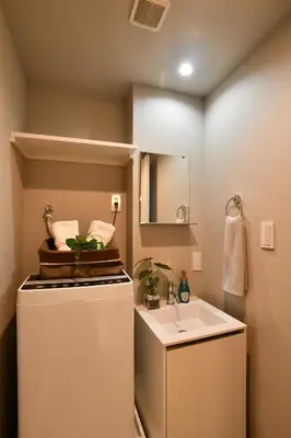 a small bathroom with a sink and a refrigerator at FL Residence Todai II in Tokyo