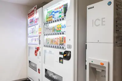 an ice machine in a room with two refrigerators at SOTETSU GRAND FRESA TAKADANOBABA in Tokyo