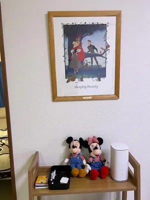 two stuffed animals sitting on a shelf under a picture at Sepia Court Inn \u30bb\u30d4\u30a2\u30b3\u30fc\u30c8\u30a4\u30f3 in Urayasu