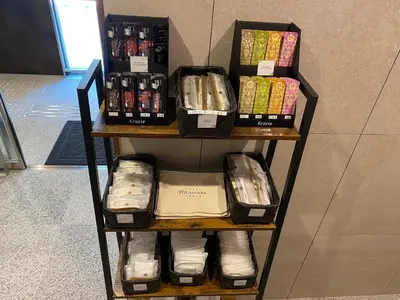 a shelf filled with lots of boxes of food at Hotel Rilassare Tokyo in Tokyo