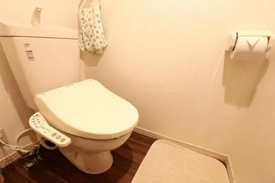 a bathroom with a toilet with a remote control at Takemura Building 107 in Tokyo