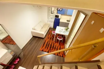 a small living room with a couch and a table at Takemura Building106 in Tokyo