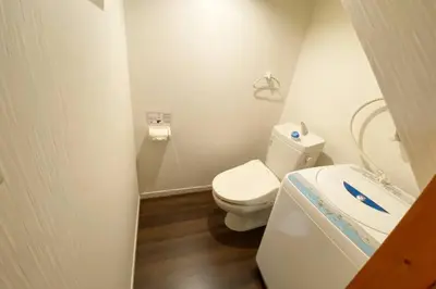 a small bathroom with a toilet and a sink at Takemura Building106 in Tokyo