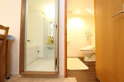 a bathroom with a shower and a toilet at Takemura Building106 in Tokyo