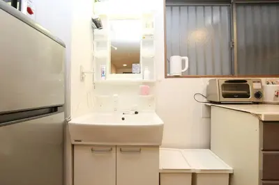 a small kitchen with a sink and a microwave at Takemura Building106 in Tokyo