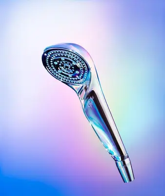 a close up of a shower head with a toothbrush at Rose Stay Tokyo Shiba Park in Tokyo